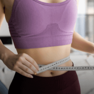 woman measuring her belly area